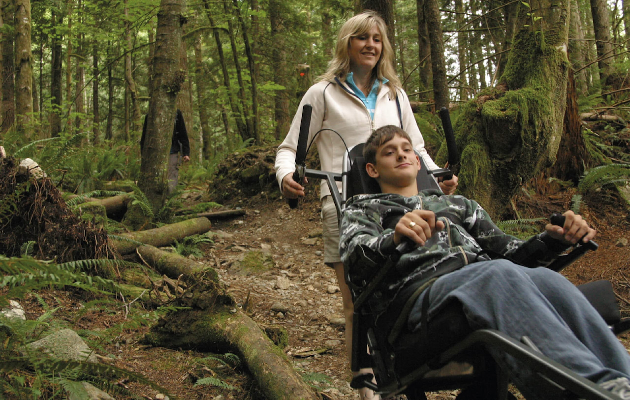 Mother and son out for a hike in a TrailRider.