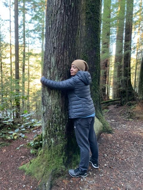 Melodia hugging a tree expressing how she loves nature.