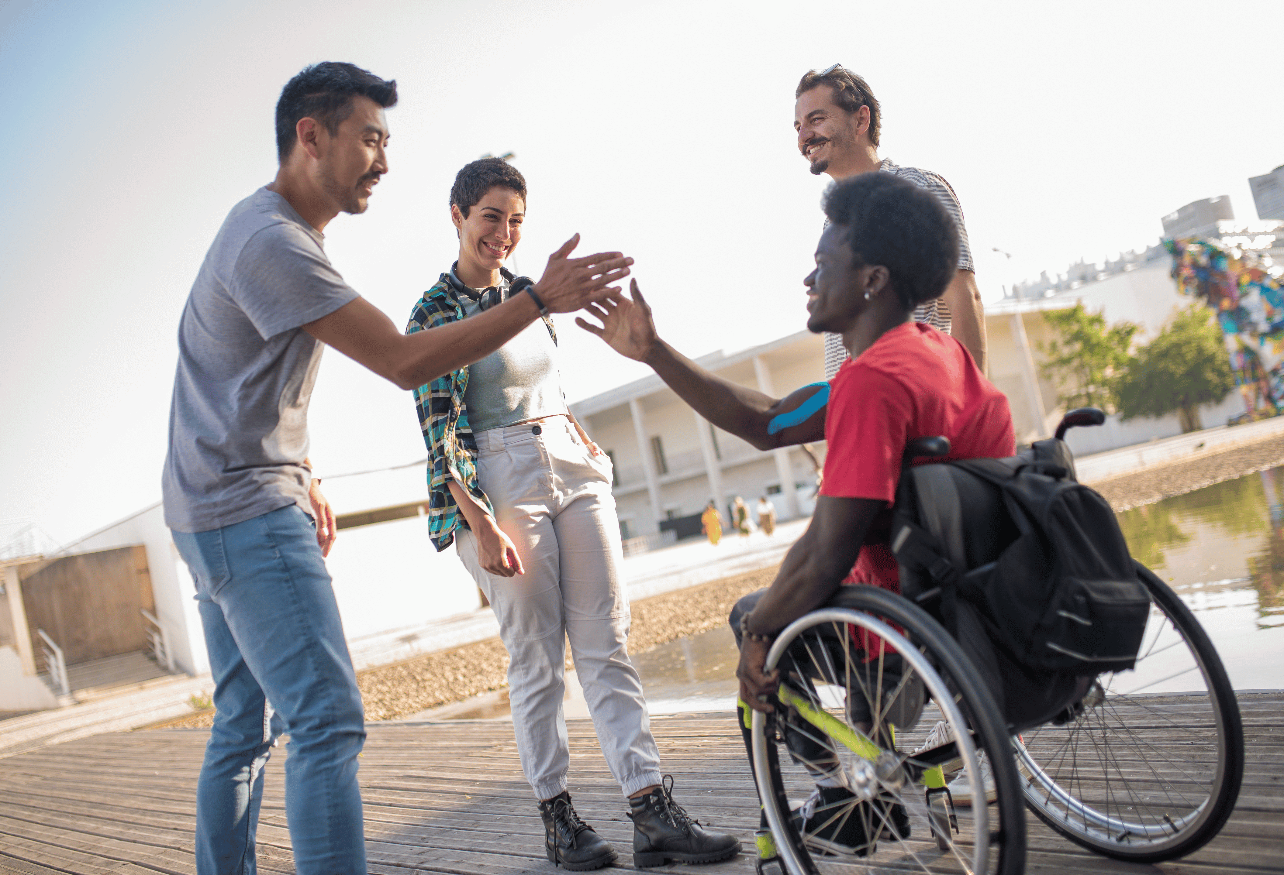 An image of disabled and able-bodied people working together.
