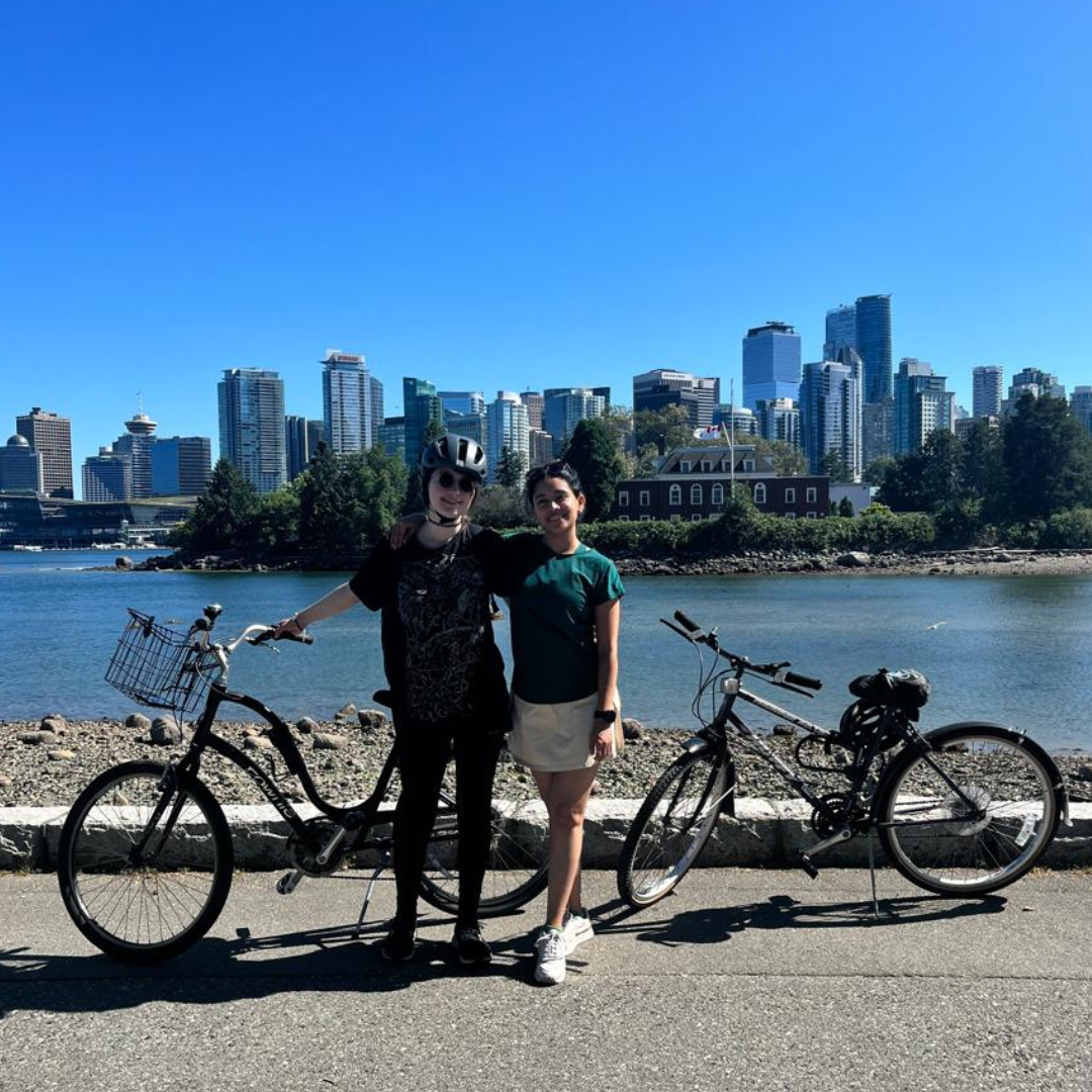 Sabrina biking around the city with a friend